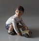 Dahl Jensen 
1166 Boy with 
toy truck (DJ) 
14 cm Marked 
with the Royal 
Crown and DJ 
Copenhagen. In 
...