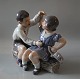 Dahl Jensen 
1214 Boy & Girl 
with ship (DJ) 
20.5 cm Marked 
with the Royal 
Crown and DJ 
...