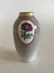 Royal 
Copenhagen Art 
nouveau vase No 
239 with gold. 
Measures 13,5cm 
and is in good 
condition.