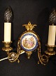 pair of wall 
sconces brass 
with a palette 
of porcelain