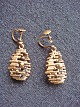 Earrings.
 Designer 
Earrings in 
bronze.
 Price Dkr. 
350, -