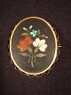 Brooch.
 Plated.
 Flower motif 
abolished in 
pietra dura 
style.
 Height: 5 cm 
Width: 4.5 cm.
 ...