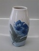 Royal 
Copenhagen 
845-238 Footed 
vase with blue 
flower 17 cm 
painter 79 
(1923-1935) In 
mint and ...