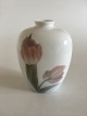 Royal 
Copenhagen Art 
Nouveau Vase 
with Tulips No 
201/134D. 
Measures 17cm 
and is in good 
condition.