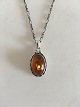 Georg Jensen 
Annual Pendent 
in Sterling 
Silver with 
Amber Stone 
2001. Chain 
measures 45 cm 
L. ...