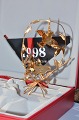 Christmas Sheaf 
1998, The 
Christmas 
Ornament from 
Georg Jensen. 
Gilded brass. 
Design : Finn 
...