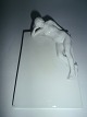 White female 
figure in 
porcelain, 
lying on a 
plate from 
Bing&Grondahl, 
Denmark approx. 
1920.
11 ...