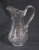 Pitcher in 
clear glass, 
Denmark, around 
1900,  with 
olive 
decorations and 
bent handle. H 
.: 24.5 cm.