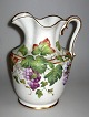 Bing & Grondahl 
pitcher in 
relief, 19th 
century. Cast 
porcelain. 
Hand-painted 
wine leaves in 
...
