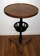 Round table of 
birch, plate 
worn by black 
painted 
baluster column 
with basket on 
three foot. ...