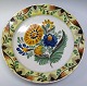 Kellinghusen 
dish, 19th 
century. A 
strong stand 
rand. Flower 
painting in 
yellow, green, 
cobalt ...