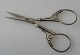 Small 
embroidery 
silver 
scissors, c. 
1900. With 
decoration. L 
.: 10,5 cm.