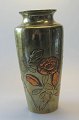 Japanese brass 
vase with 
decorations in 
the form of 
flowers, c. 
1900. Some of 
the flowers are 
...