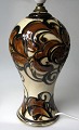 Lamp base, 
Dagnæs 
Ceramics, 
Denmark, 1930. 
Cream-colored 
bottom with 
decorations in 
black and ...