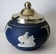 Tunstall 
marmalade jar, 
1916, England. 
Bisquit figures 
on blue ground. 
With 
silver-plated 
lid. ...