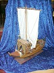 Large beautiful 
Sail ship 
loaded with 
timber port 
wine barrels.
one of the men 
standing with 
...