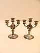 A pair of three 
armed pewter 
candlesticks 
height 12 cm.   
 No. 226504