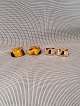 Cufflinks.
1 set of 
Tigerøje length 
of tiger eye 
2.6cm. and a 
pair of 
gold-plated.
kr for both 
...