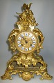 French mantle 
clock in 
ormelue bronze, 
New rococo, c. 
1840. Decorated 
with rocaille, 
wicker ...