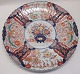 Large Japanese 
Imari dish, 
19th century. 
Wavy edge. 
Bluish 
underglaze. 
Richly 
decorated with 
red ...