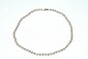 Pearl necklace 
with white 
gold's lås 14 
Karat Gold
Stamp: 14k G
Length 35 cm.
Pearl 4 ...