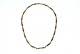Elegant 
necklace, 14 
karat gold
Stamped: 585, 
Sv, H
Length 42 cm.
Width 4.75 mm.
Thickness 2 
...
