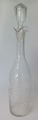 Danish Rome 
bottle of clear 
glass with 
stopper, 
Denmark. o. 
1910. H: 31 cm. 
With etched 
text: ...