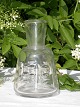 Holmegaard 
glassworks. 
Water decanter 
with 
decoration. 
Height 18,5 
cms. Fine 
condition.