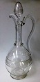Wine jug in 
clear glass, 
19th century. 
With cuts and 
handle. H .: 32 
cm.