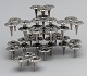 13 design 
candlesticks in 
white metal, 
can be 
assembled into 
modules. 
Unmarked.
A module ...