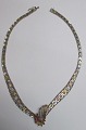 Necklace in 
sterling 
silver, 
partially gilt, 
Italy, 20th 
century. With 
six faux 
rubies. L .: 42 
...