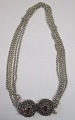 Swedish Peasant 
necklace in 
silver, 19th 
century. L. 42 
cm. Stamped: 
PH. With red 
glass stones. 
...