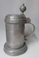 Pewter drinking 
mug with a ball 
shaped thumb 
piece, 1822, 
Germany. Smooth 
corpus. With 
...