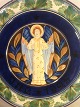 Christmas 
Relief plate 
1925 Standing 
angel with 
pelvic R. 
Harboe
Diameter 31.5 
cm.
Polychrome ...
