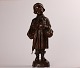 Elna Borch 
(1869-1950)
Figure of 
young boy with 
umbrella and 
bag
made of bronze 
with brown ...