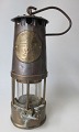 English mining 
lamp in brass 
and iron, 19th 
century. Height 
.: 24 cm. With 
hook and glass. 
With ...