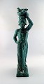 Harald Salomon 
for Rörstrand, 
green glazed 
stoneware/art 
pottery figure 
of a woman 
bearing ...