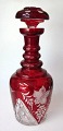 Bohemian 
crystal 
decanter with 
cuttings, 20th 
century. With 
red overlay. 
Large cuts on 
the body. ...