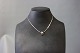 Necklace in 925 
sterling silver 
with pendant 
decorated with 
14 ct. gold.
40 cm.