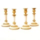 Set of four 
candle holders, 
marble and 
bronze
France around 
1810
H: 19,5cm