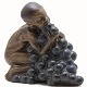 Bing & 
Grøndahl: Kai 
Nielsen. 
Figurine. A boy 
with a bunch of 
grapes. Signed 
"Kai Nielsen". 
H. ...