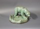 Small ceramic 
dish with 
figure in green 
colors by 
Michael 
Andersen & Son.
H - 13,5 cm 
and Dia - ...