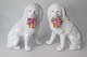 Par poodle 
porcelain dogs 
with flower 
baskets in the 
mouth, Germany, 
19th century. 
White ...
