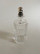 Georg Jensen 
Baccarat Bottle 
with Sterling 
Silver Pyramid 
Bottle Lid No 
206. 26 cm tall 
(10 ...