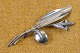 Silver brooch 
shaped like 
Calla flower 
with elongated 
pistil and 
leaf. Stamped 
"AG" Sterling. 
...