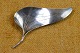 Brooch of 
silver formed 
as a 
funnel-shaped 
asymmetric 
petal. Hallmark 
"Original 
Ulrich" 
Sterling ...