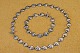 Collier 
necklace and 
bracelet 
silver. 
Necklaces and 
bracelets 
consist of 
small fine 
serrated ...