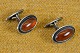 Cufflinks with 
amber. Stampe 
Sterling 925S 
N.E.From 
Denmark. Str.: 
2,2*1,5 cm. 
Art. No. 97