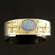 Thor Selzer 
Sterling Silver 
Bangle pertly 
gilded with 
Opal.
Designed by 
Hermann ...