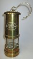 English antique 
mining lamp, 
19th century. 
Brass. Marked: 
Cymru. H .: 22 
cm. With 
supporting 
hook.